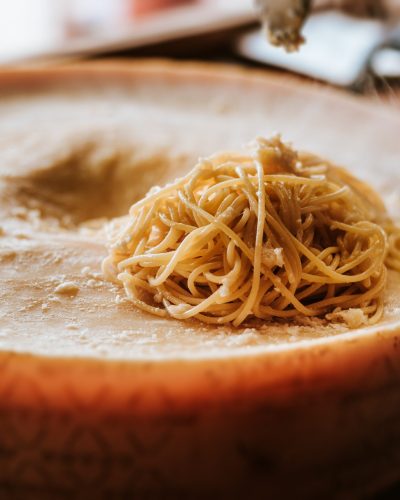 Delicious spaghetti pasta preparation. Spaghetti pasta in a parmesan cheese wheel.