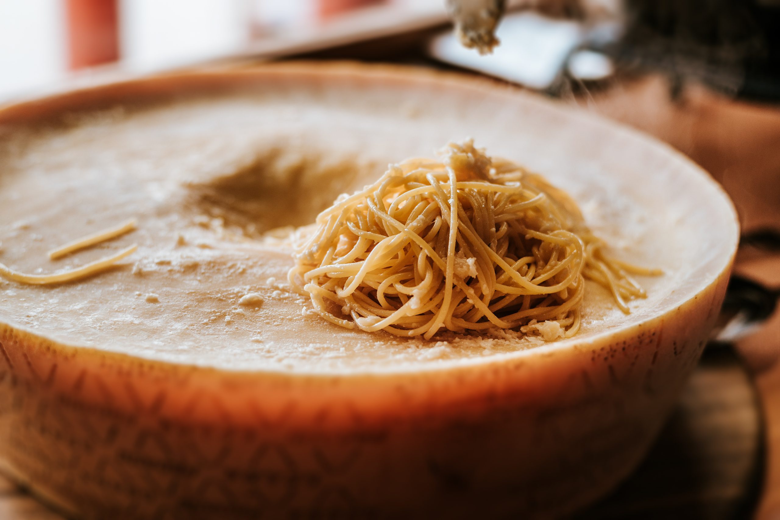 Delicious spaghetti pasta preparation. Spaghetti pasta in a parmesan cheese wheel.